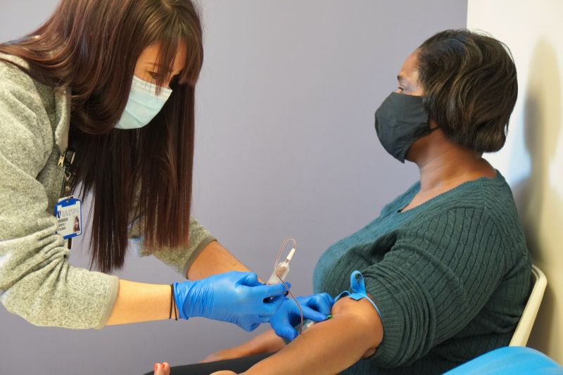 A study team member enrolls a participant in the Duke APOL1 Study at Duke Kannapolis in 2020.