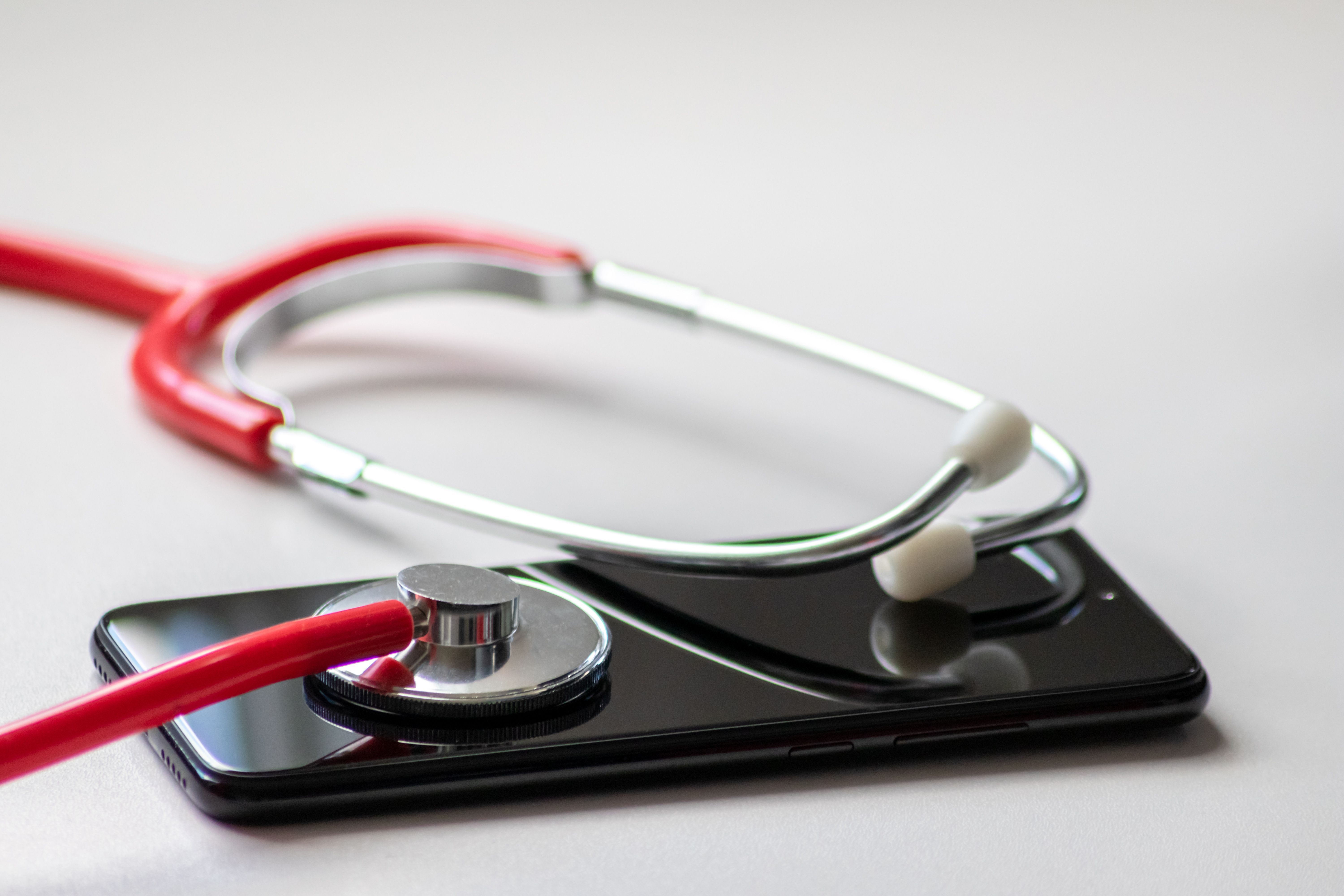 Stethoscope on black smartphone