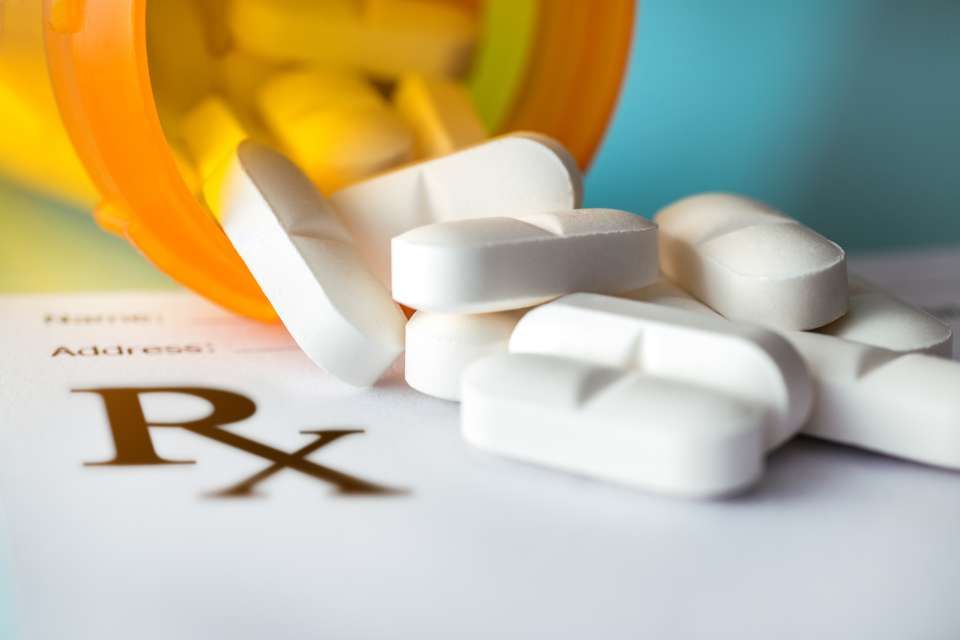 Image of pills spilling out of pill bottle